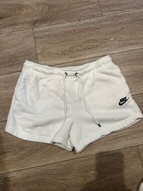 Nike Women's White Athletic Shorts with Black Swoosh